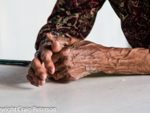An elderly farmer's hands