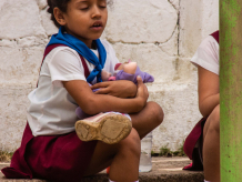 Schoolgirl with doll